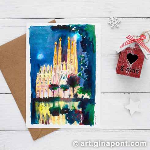 Felicitación navideña: Sagrada Família de noche con la estrella de cristal iluminada en una de las torres principales de la basílica.